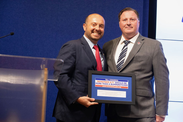 Andrew Ansbro, President Uniformed Firefighters Association, presents award to Congressman Andrew Garbarino.